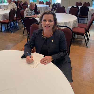 Alabama State Bar President Christy Crow signing a card for Mr. South. 
